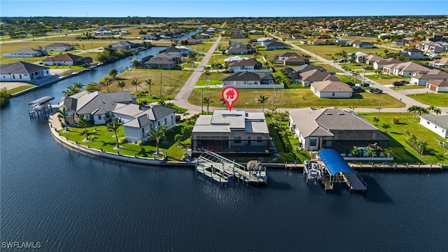 aerial view with a residential view and a water view