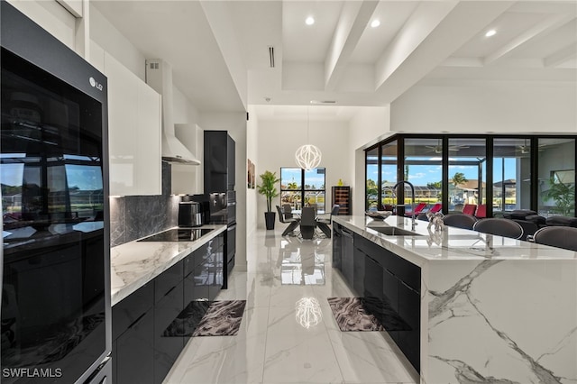 3303 NW 14th St, Cape Coral, FL 33993 - kitchen with dark cabinets, a sink, modern cabinets, marble finish floor, and recessed lighting