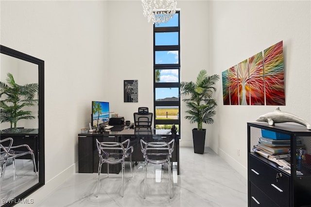 3303 NW 14th St, Cape Coral, FL 33993 - office featuring a towering ceiling, marble finish floor, baseboards, and a notable chandelier