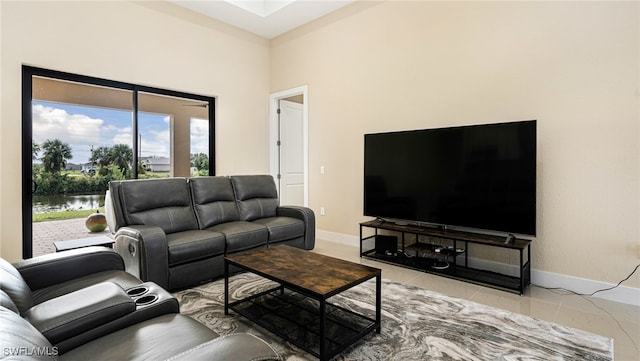 tiled living area with baseboards