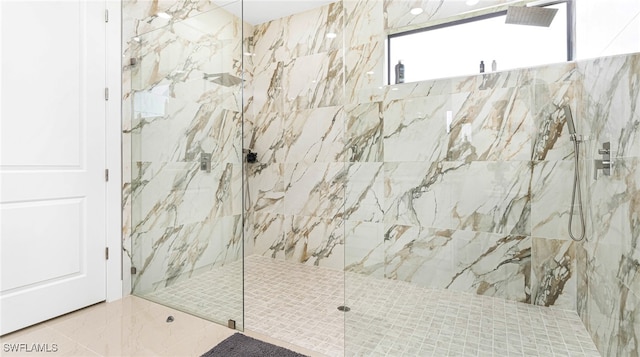 full bath featuring a marble finish shower