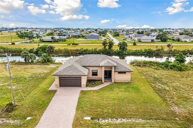 bird's eye view featuring a water view and a residential view