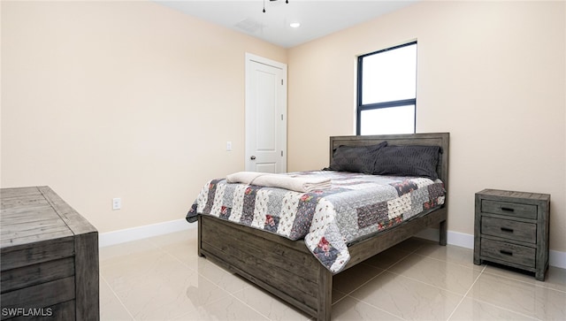 bedroom with baseboards and ceiling fan