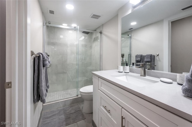 bathroom featuring visible vents, toilet, a shower stall, and vanity