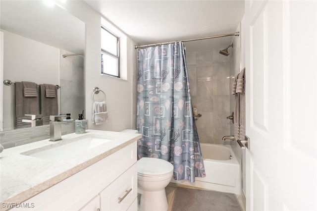 bathroom with vanity, toilet, and shower / tub combo with curtain