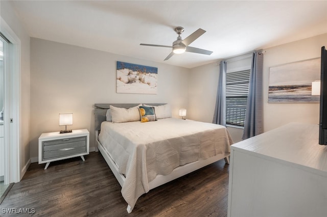 bedroom featuring a ceiling fan, dark wood-type flooring, and baseboards