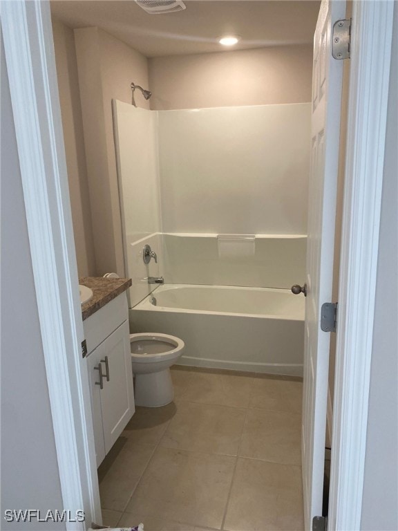 full bathroom with tile patterned floors, toilet, vanity, and washtub / shower combination