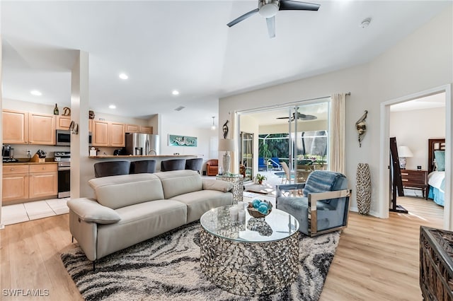 living room with recessed lighting, light wood-style flooring, and ceiling fan