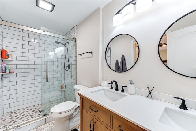 full bathroom with a sink, toilet, and a shower stall