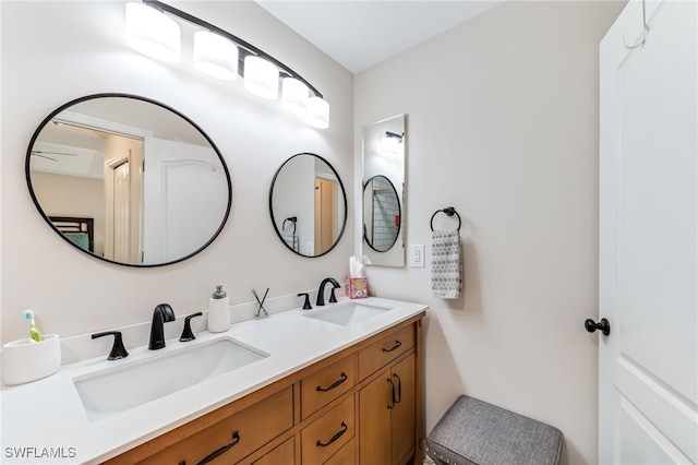 bathroom featuring double vanity and a sink