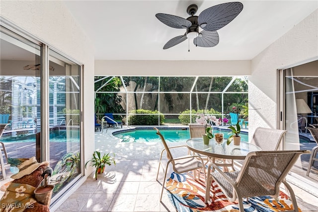 pool with a patio area, a lanai, and ceiling fan