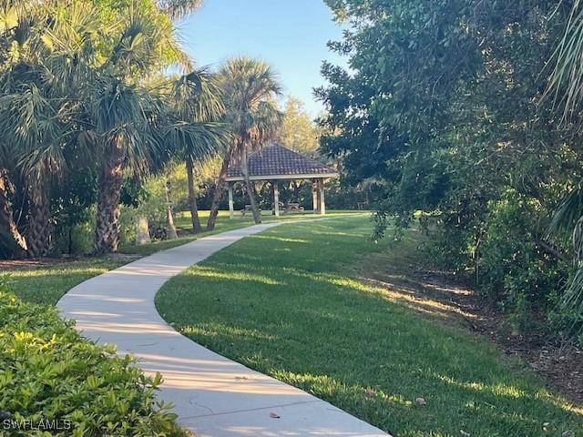 view of property's community with a gazebo and a lawn