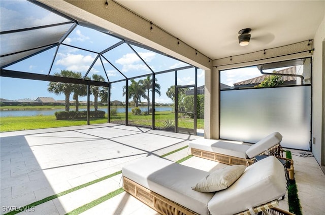 unfurnished sunroom with a water view