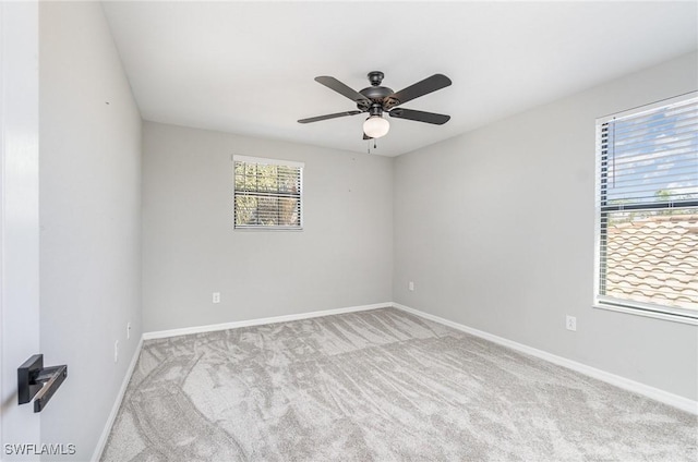 unfurnished room with baseboards, carpet floors, and ceiling fan