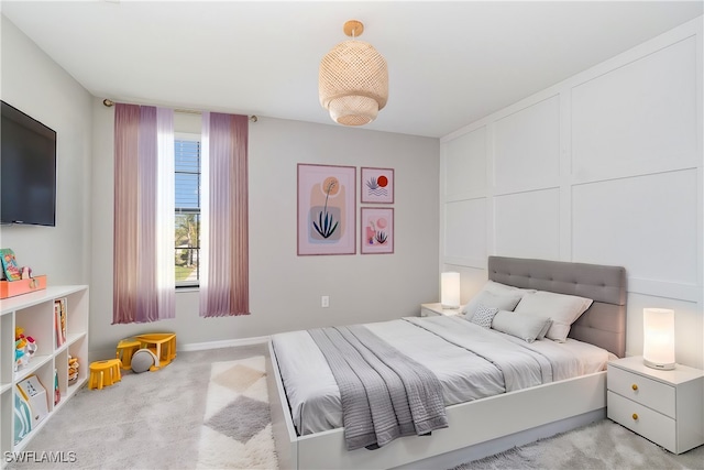 bedroom featuring light colored carpet