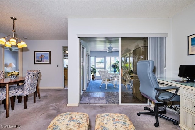 carpeted office with ceiling fan with notable chandelier, baseboards, and a textured ceiling