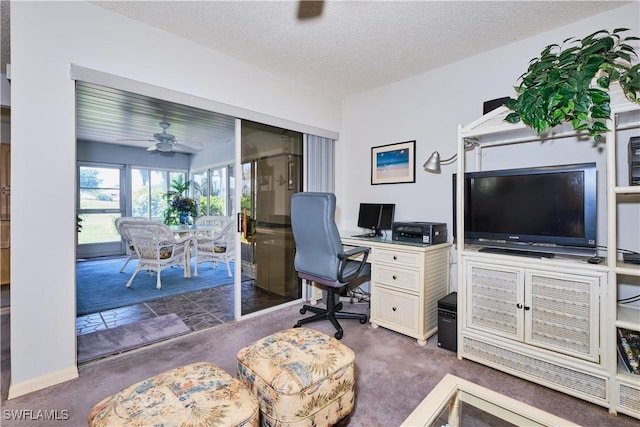 office with a textured ceiling, a ceiling fan, and carpet floors