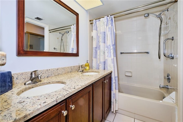 full bath with a sink, double vanity, tile patterned floors, and shower / bath combination with curtain