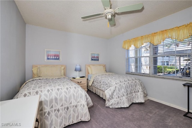 bedroom with carpet flooring, ceiling fan, a textured ceiling, and baseboards