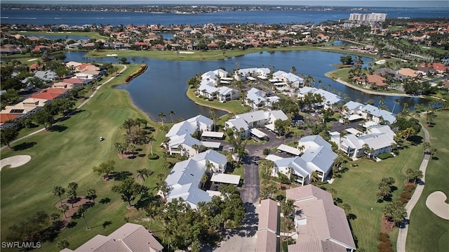 aerial view featuring view of golf course, a residential view, and a water view