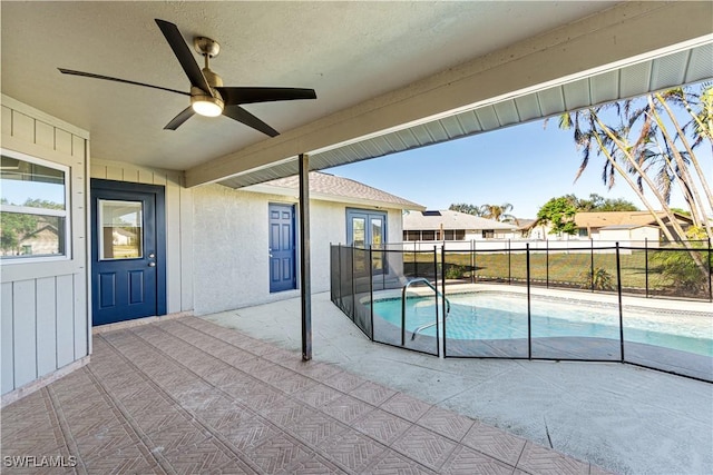 view of pool featuring a fenced in pool, fence, a ceiling fan, and a patio area