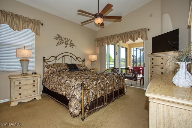 bedroom with light colored carpet, access to exterior, a ceiling fan, and vaulted ceiling