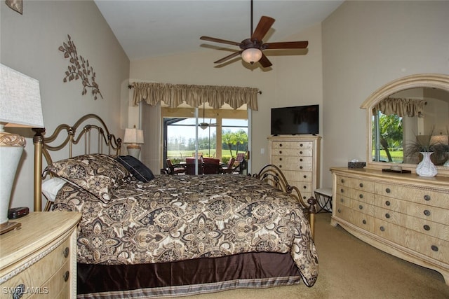 bedroom featuring a ceiling fan, lofted ceiling, access to outside, and carpet