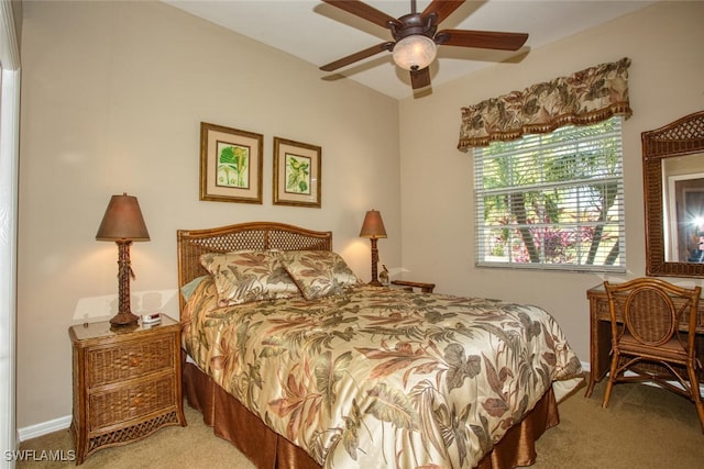 carpeted bedroom with a ceiling fan and baseboards