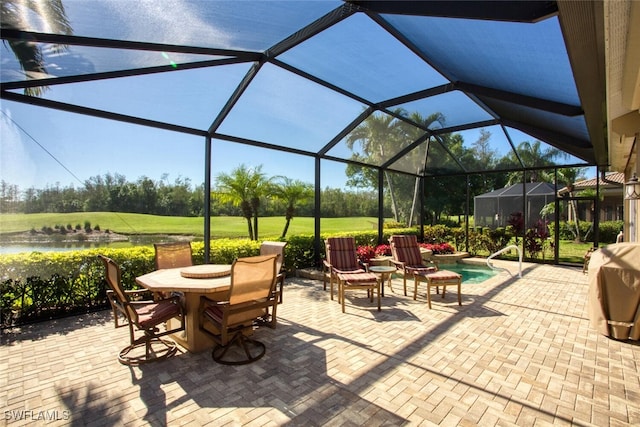 view of patio with glass enclosure and outdoor dining space