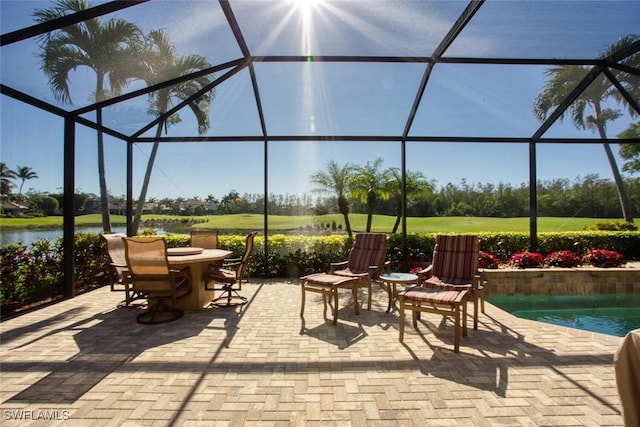 view of patio / terrace with glass enclosure and outdoor dining space