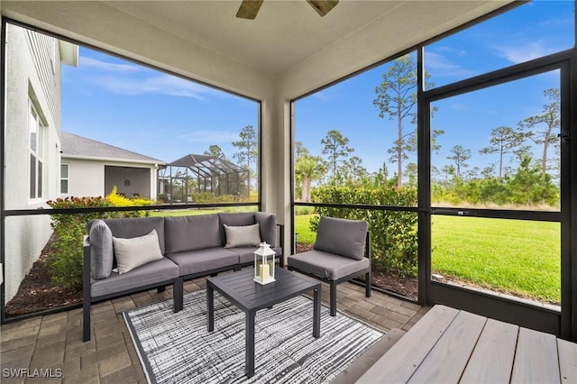 sunroom with a ceiling fan