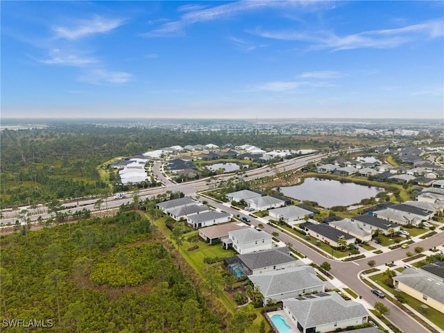 bird's eye view featuring a residential view and a water view