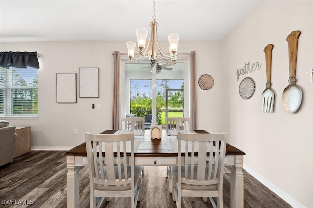 dining room with wood finished floors, baseboards, and a chandelier