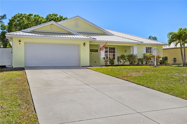 single story home featuring a front lawn, concrete driveway, stucco siding, metal roof, and a standing seam roof