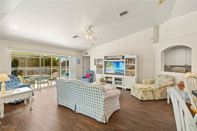 living room with vaulted ceiling, dark wood-style floors, visible vents, and ceiling fan