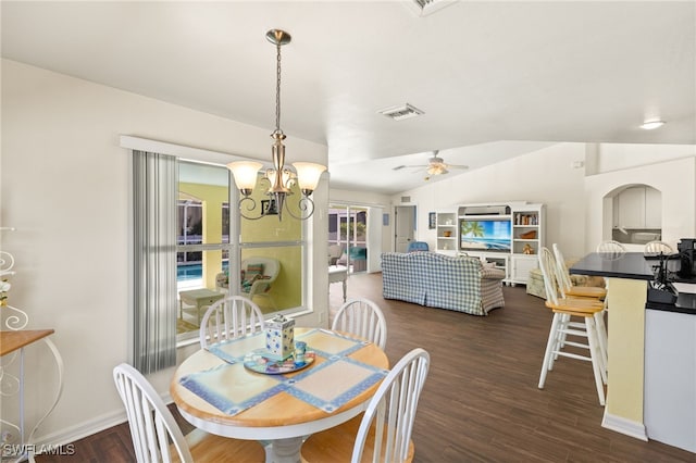 dining space featuring visible vents, baseboards, vaulted ceiling, ceiling fan with notable chandelier, and dark wood-style flooring