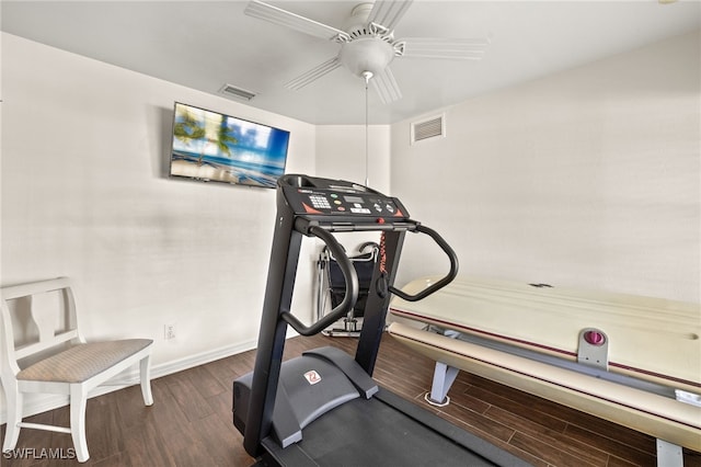 workout room featuring a ceiling fan, wood finished floors, visible vents, and baseboards