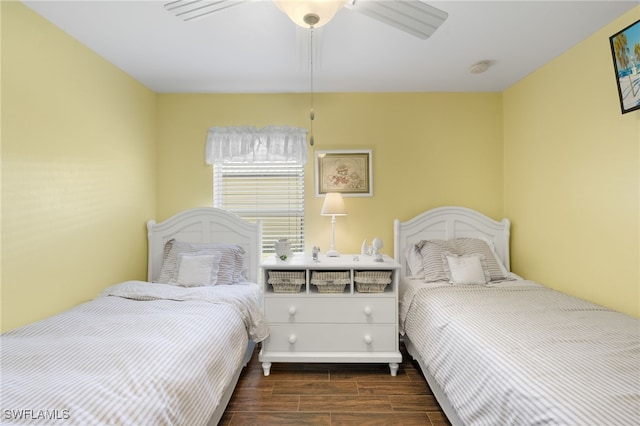 bedroom with a ceiling fan and wood finish floors