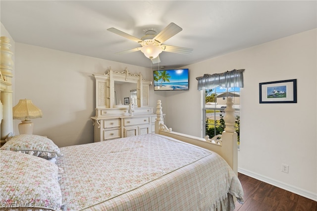 bedroom with baseboards, dark wood-type flooring, and ceiling fan