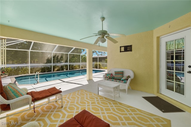 pool featuring a patio area, a lanai, and ceiling fan