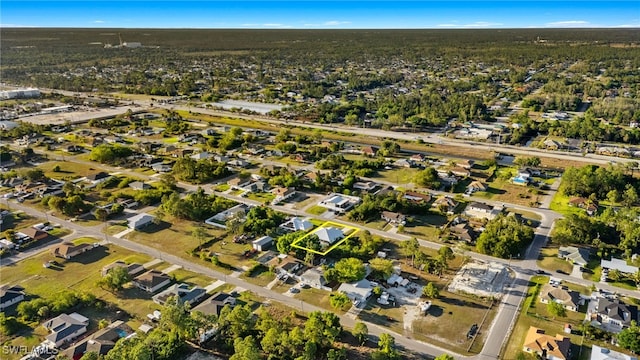 birds eye view of property with a residential view