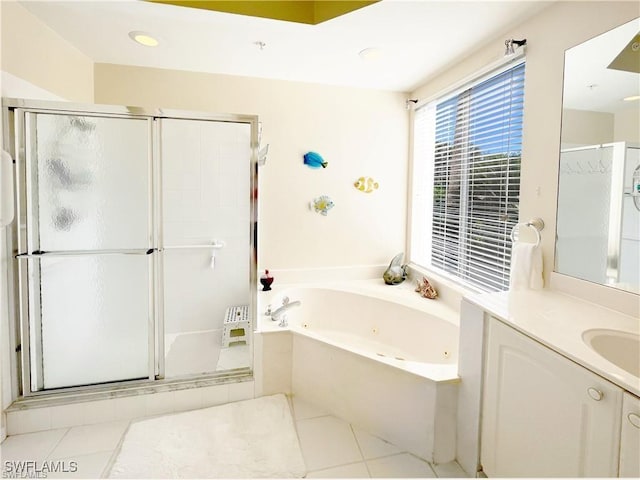 bathroom featuring vanity, tile patterned flooring, a whirlpool tub, and a stall shower