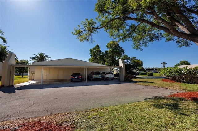 view of car parking with a carport and driveway