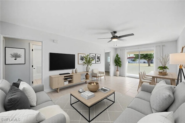 living room featuring light tile patterned flooring and a ceiling fan