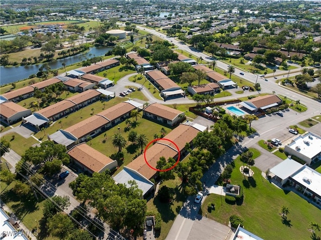 birds eye view of property with a residential view and a water view