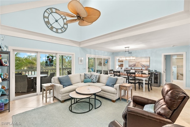 living area featuring wine cooler, a ceiling fan, and tile patterned flooring