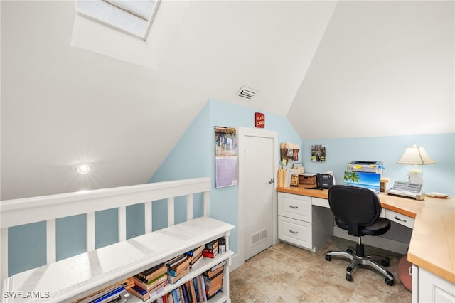 home office with lofted ceiling with skylight and visible vents