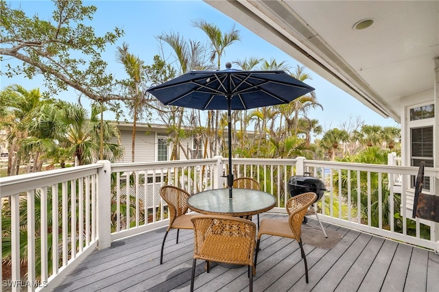 deck featuring outdoor dining area