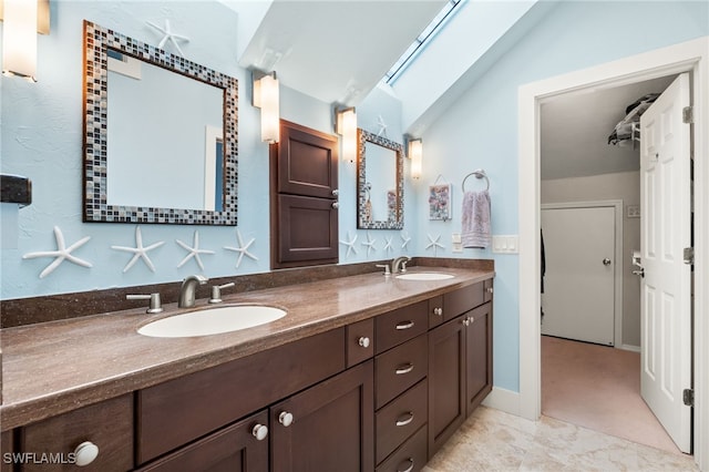 bathroom featuring double vanity and a sink