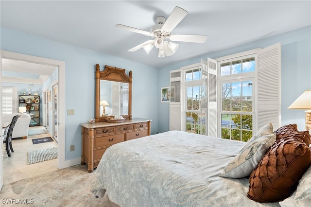 bedroom with baseboards and ceiling fan